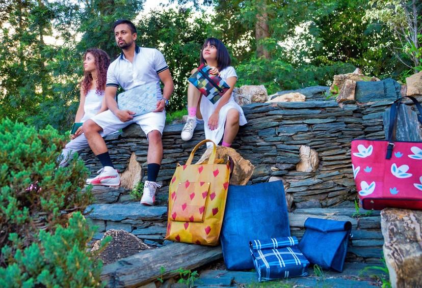 Conserve India showing their upcycled plastic transformed into a high-value leather alternative as bags. 