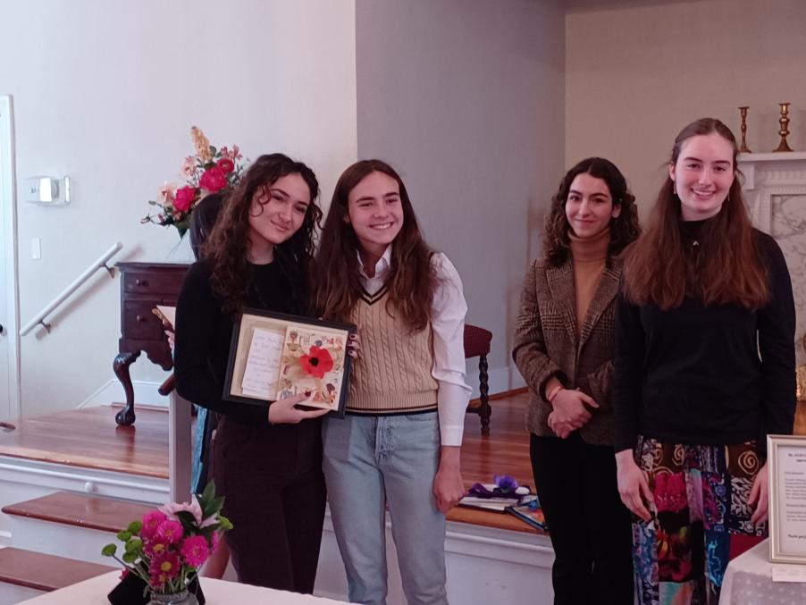 50/50 Club vice president Ava Thomas presents the award for Best Student Art to Giulia Leonetti (photo courtesy of Margaret Gammie)
