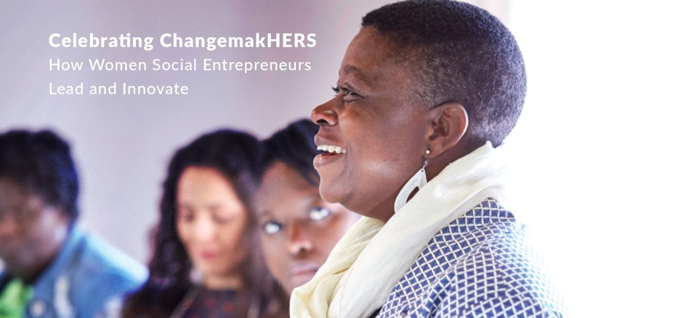 A web banner that features several women participating in a discussion. Three women follow as a black woman with short hair in a white scarf and checkered blouse speaks. Near her face the text reads Celebrating Change make Hers How Women Social Entrepreneurs Lead and Innovate